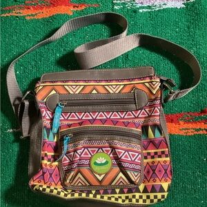 Lilly Bloom Cross Body Purse, Floral & Aztec purse
Width 9”
Length 10”